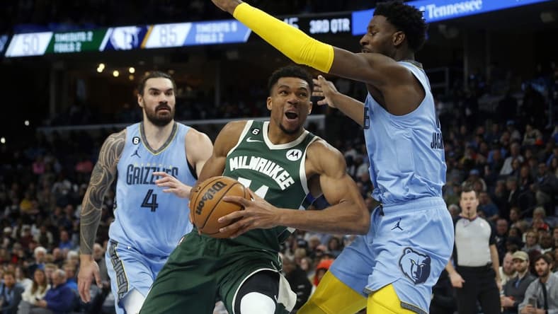 Dec 15, 2022; Memphis, Tennessee, USA; Milwaukee Bucks forward Giannis Antetokounmpo (34) drives to the basket as Memphis Grizzlies forward Jaren Jackson Jr. (13) defends during the second half at FedExForum. Mandatory Credit: Petre Thomas-USA TODAY Sports