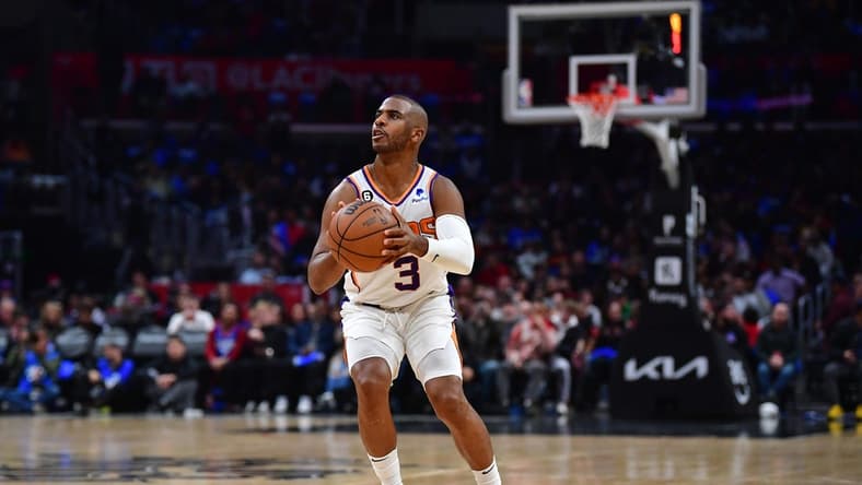 Dec 15, 2022; Los Angeles, California, USA; Phoenix Suns guard Chris Paul (3) shoots against the Los Angeles Clippers during the second half at Crypto.com Arena. Mandatory Credit: Gary A. Vasquez-USA TODAY Sports
