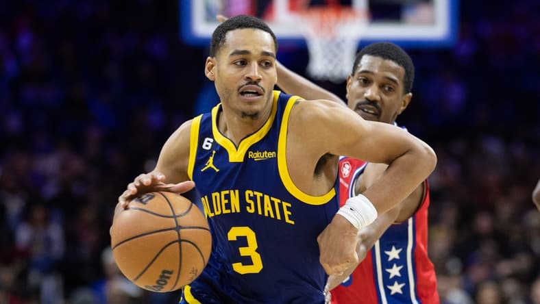 Dec 16, 2022; Philadelphia, Pennsylvania, USA; Golden State Warriors guard Jordan Poole (3) drives past Philadelphia 76ers guard De'Anthony Melton (8) during the second quarter at Wells Fargo Center. Mandatory Credit: Bill Streicher-USA TODAY Sports