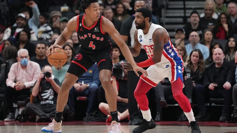 Dec 16, 2022; Toronto, Ontario, CAN; Toronto Raptors forward Scottie Barnes (4) controls the ball as Brooklyn Nets guard Kyrie Irving (11) tries to defend during the first quarter at the Scotiabank Arena. Mandatory Credit: Nick Turchiaro-USA TODAY Sports