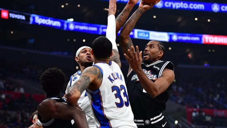 Dec 17, 2022; Los Angeles, California, USA; Los Angeles Clippers forward Kawhi Leonard (2) shoots against the Washington Wizards during the first half at Crypto.com Arena. Mandatory Credit: Gary A. Vasquez-USA TODAY Sports