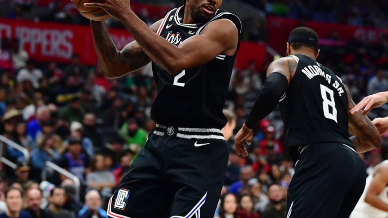 Dec 17, 2022; Los Angeles, California, USA; Los Angeles Clippers forward Kawhi Leonard (2) gets the rebound against the Washington Wizards during the second half at Crypto.com Arena. Mandatory Credit: Gary A. Vasquez-USA TODAY Sports