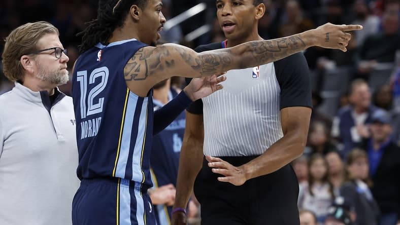 Dec 17, 2022; Oklahoma City, Oklahoma, USA; Memphis Grizzlies guard Ja Morant (12) points to fans before being ejected from the game following a play against the Oklahoma City Thunder during the second quarter at Paycom Center. Mandatory Credit: Alonzo Adams-USA TODAY Sports