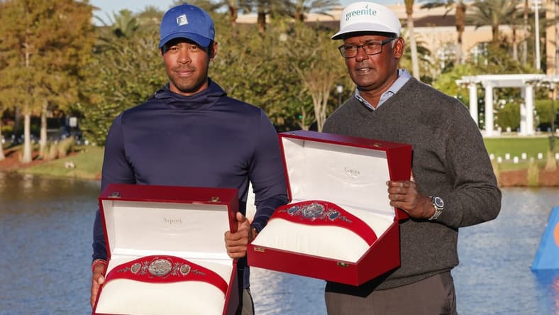 Dec 18, 2022; Orlando, Florida, USA; Vijay Singh (right) and Qass Singh hold up the Champions trophy after winning the PNC Championship golf tournament at Ritz Carlton Golf Club Grande Lakes Orlando Course. Mandatory Credit: Reinhold Matay-USA TODAY Sports