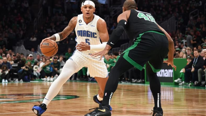 Dec 18, 2022; Boston, Massachusetts, USA; Orlando Magic forward Paolo Banchero (5) controls the ball while Boston Celtics center Al Horford (42) during the first half at TD Garden. Mandatory Credit: Bob DeChiara-USA TODAY Sports