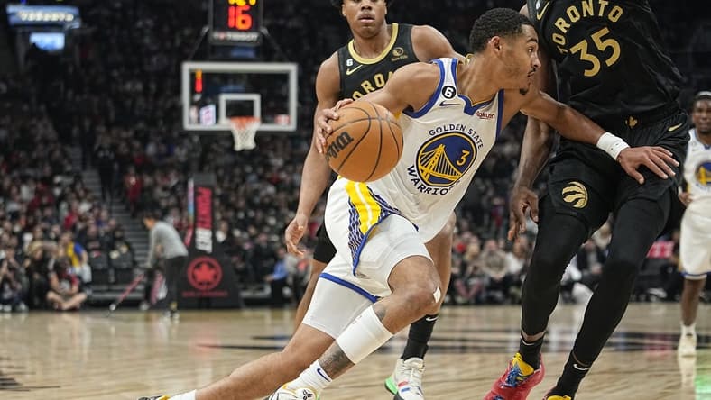 Dec 18, 2022; Toronto, Ontario, CAN; Golden State Warriors guard Jordan Poole (3) drives to the net against Toronto Raptors forward Christian Koloko (35) during the first half at Scotiabank Arena. Mandatory Credit: John E. Sokolowski-USA TODAY Sports