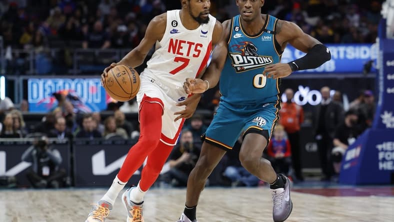 Dec 18, 2022; Detroit, Michigan, USA; Brooklyn Nets forward Kevin Durant (7) dribbles on Detroit Pistons center Jalen Duren (0) in the first half at Little Caesars Arena. Mandatory Credit: Rick Osentoski-USA TODAY Sports