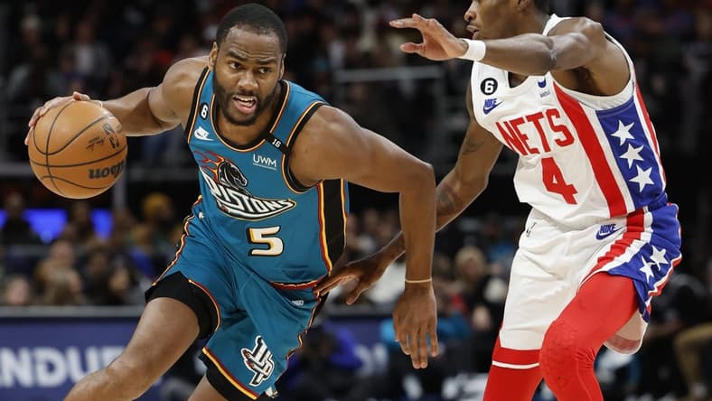Dec 18, 2022; Detroit, Michigan, USA; Detroit Pistons guard Alec Burks (5) dribbles defended by Brooklyn Nets guard Edmond Sumner (4) in the first half at Little Caesars Arena. Mandatory Credit: Rick Osentoski-USA TODAY Sports