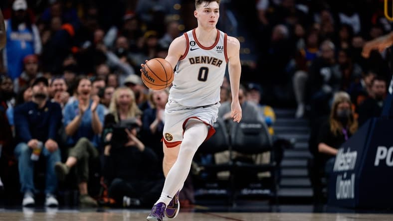 Dec 18, 2022; Denver, Colorado, USA; Denver Nuggets guard Christian Braun (0) dribbles the ball up court in the fourth quarter against the Charlotte Hornets at Ball Arena. Mandatory Credit: Isaiah J. Downing-USA TODAY Sports