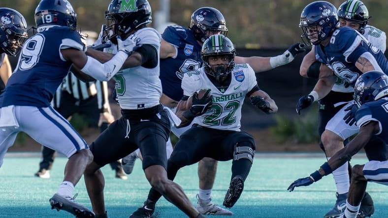 Dec 19, 2022; Conway, South Carolina, USA; Marshall Thundering Herd running back Rasheen Ali (22) looks for some running room in the first half against the Connecticut Huskies in the Myrtle Beach Bowl at Brooks Stadium. Mandatory Credit: David Yeazell-USA TODAY Sports