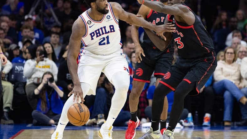 Dec 19, 2022; Philadelphia, Pennsylvania, USA; Philadelphia 76ers center Joel Embiid (21) dribbles the ball against Toronto Raptors forward Pascal Siakam (43) during the second quarter at Wells Fargo Center. Mandatory Credit: Bill Streicher-USA TODAY Sports