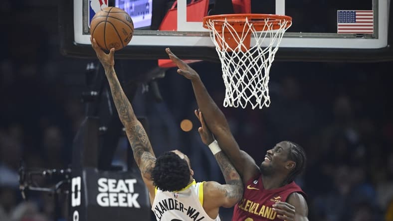 Dec 19, 2022; Cleveland, Ohio, USA; Utah Jazz guard Nickeil Alexander-Walker (6) shoots beside Cleveland Cavaliers guard Caris LeVert (3) in the second quarter at Rocket Mortgage FieldHouse. Mandatory Credit: David Richard-USA TODAY Sports