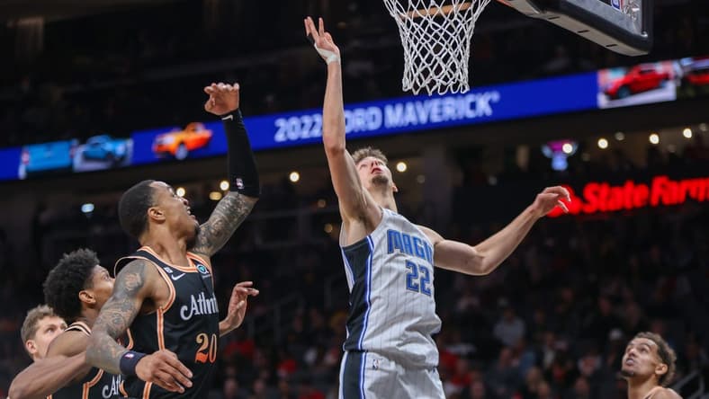 Dec 19, 2022; Atlanta, Georgia, USA; Orlando Magic forward Franz Wagner (22) reaches for a rebound against the Atlanta Hawks in the second quarter at State Farm Arena. Mandatory Credit: Brett Davis-USA TODAY Sports