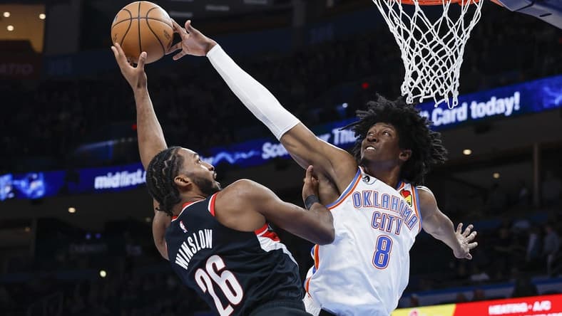 Dec 19, 2022; Oklahoma City, Oklahoma, USA; Oklahoma City Thunder forward Jalen Williams (8) blocks a shot by Portland Trail Blazers forward Justise Winslow (26) during the second quarter at Paycom Center. Mandatory Credit: Alonzo Adams-USA TODAY Sports