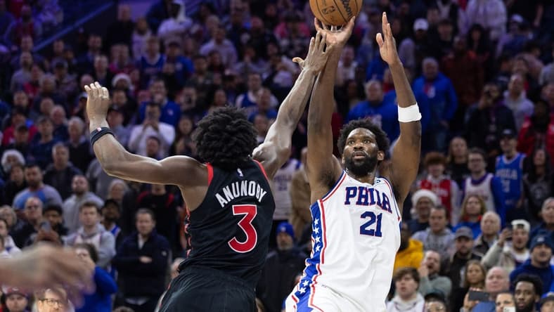 Dec 19, 2022; Philadelphia, Pennsylvania, USA; Philadelphia 76ers center Joel Embiid (21) shoots the ball over Toronto Raptors forward O.G. Anunoby (3) during the fourth quarter at Wells Fargo Center. Mandatory Credit: Bill Streicher-USA TODAY Sports