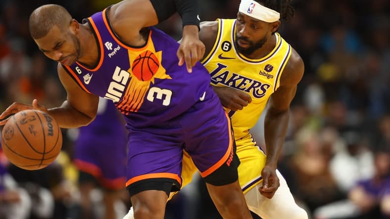 Dec 19, 2022; Phoenix, Arizona, USA; Phoenix Suns guard Chris Paul (3) is fouled by Los Angeles Lakers guard Patrick Beverley in the first half at Footprint Center. Mandatory Credit: Mark J. Rebilas-USA TODAY Sports