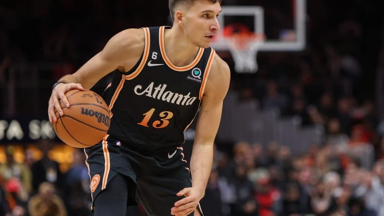 Dec 19, 2022; Atlanta, Georgia, USA; Atlanta Hawks guard Bogdan Bogdanovic (13) dribbles against the Orlando Magic in the second half at State Farm Arena. Mandatory Credit: Brett Davis-USA TODAY Sports