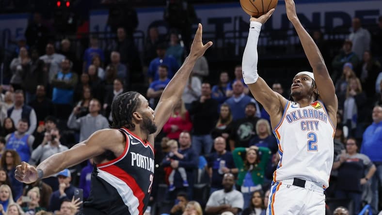 Dec 19, 2022; Oklahoma City, Oklahoma, USA; Oklahoma City Thunder guard Shai Gilgeous-Alexander (2) shoots the game winning shot against Portland Trail Blazers forward Justise Winslow (26) during the second half at Paycom Center. Oklahoma City won 123-121. Mandatory Credit: Alonzo Adams-USA TODAY Sports