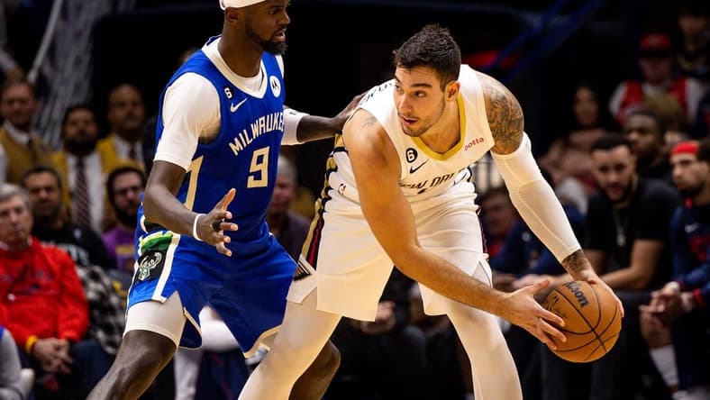 Dec 19, 2022; New Orleans, Louisiana, USA; New Orleans Pelicans center Willy Hernangomez (9) looks to pass the ball against Milwaukee Bucks forward Bobby Portis (9) during the second half at Smoothie King Center. Mandatory Credit: Stephen Lew-USA TODAY Sports