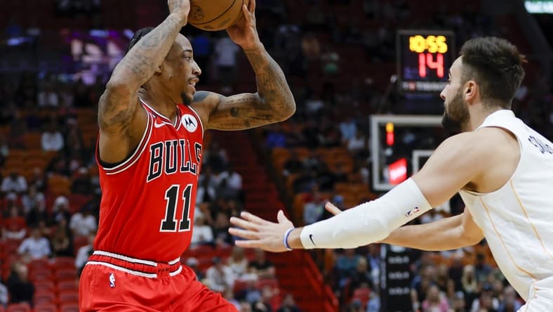 Dec 20, 2022; Miami, Florida, USA; Chicago Bulls forward DeMar DeRozan (11) protects the basketball from Miami Heat guard Max Strus (31) during the first quarter at FTX Arena. Mandatory Credit: Sam Navarro-USA TODAY Sports