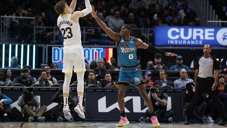 Dec 20, 2022; Detroit, Michigan, USA; Utah Jazz forward Lauri Markkanen (23) shoots over Detroit Pistons center Jalen Duren (0) in the first half at Little Caesars Arena. Mandatory Credit: Rick Osentoski-USA TODAY Sports