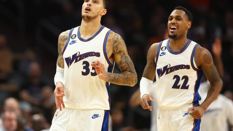 Dec 20, 2022; Phoenix, Arizona, USA; Washington Wizards forward Kyle Kuzma (33) celebrates a three point shot with guard Monte Morris (22) against the Phoenix Suns in the second half at Footprint Center. Mandatory Credit: Mark J. Rebilas-USA TODAY Sports