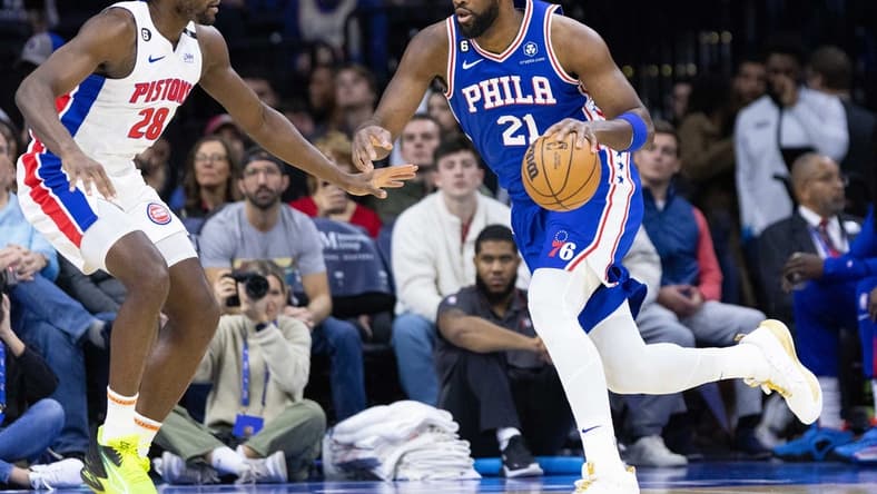 Dec 21, 2022; Philadelphia, Pennsylvania, USA; Philadelphia 76ers center Joel Embiid (21) drives against Detroit Pistons center Isaiah Stewart (28) during the first quarter at Wells Fargo Center. Mandatory Credit: Bill Streicher-USA TODAY Sports