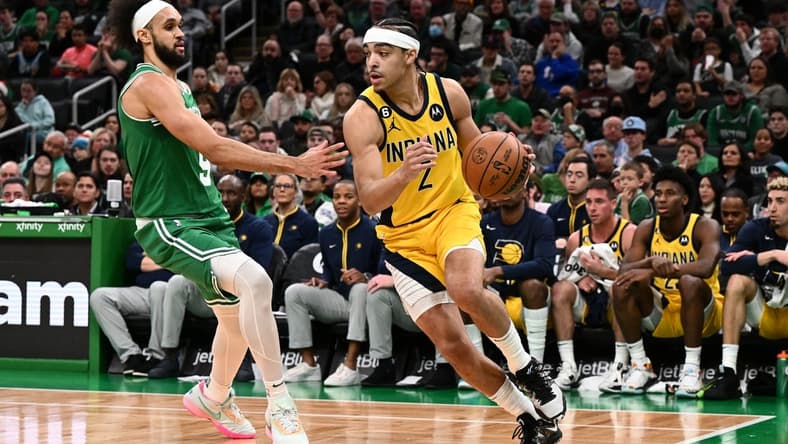 Dec 21, 2022; Boston, Massachusetts, USA; Indiana Pacers guard Andrew Nembhard (2) drives to the basket against Boston Celtics guard Derrick White (9) during the second quarter at the TD Garden. Mandatory Credit: Brian Fluharty-USA TODAY Sports