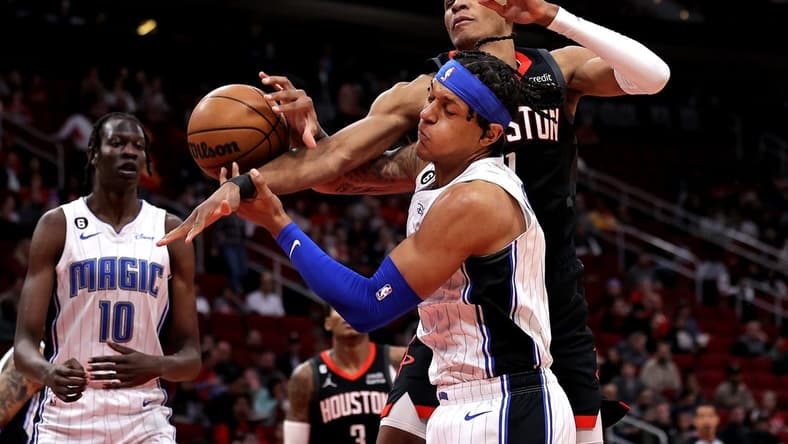 Dec 21, 2022; Houston, Texas, USA; Orlando Magic forward Paolo Banchero (5) and Houston Rockets forward Jabari Smith Jr. (1) battle for a rebound during the first quarter at Toyota Center. Mandatory Credit: Erik Williams-USA TODAY Sports