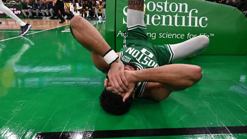 Dec 21, 2022; Boston, Massachusetts, USA; Boston Celtics forward Jayson Tatum (0) reacts after being fouled during the fourth quarter of a game against the Indiana Pacers at the TD Garden. Mandatory Credit: Brian Fluharty-USA TODAY Sports