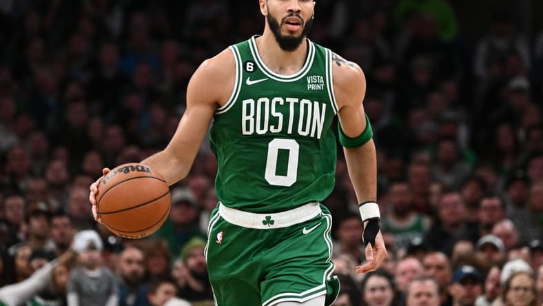 Dec 21, 2022; Boston, Massachusetts, USA; Boston Celtics forward Jayson Tatum (0) dribbles the ball against the Indiana Pacers during the third quarter at the TD Garden. Mandatory Credit: Brian Fluharty-USA TODAY Sports