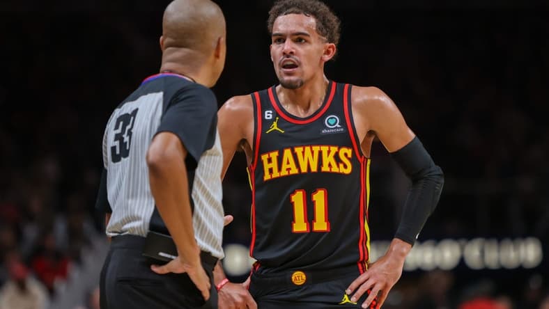 Dec 21, 2022; Atlanta, Georgia, USA; Atlanta Hawks guard Trae Young (11) talks to referee Sean Corbin (33) against the Chicago Bulls in the second half at State Farm Arena. Mandatory Credit: Brett Davis-USA TODAY Sports
