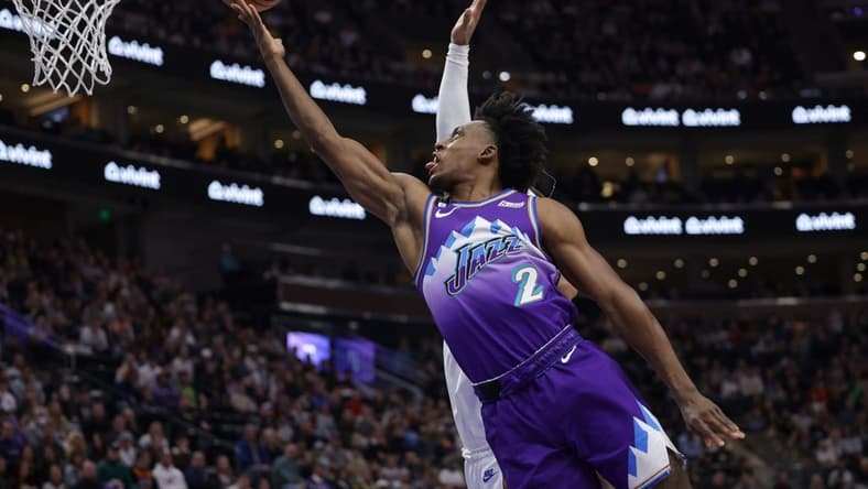 Dec 22, 2022; Salt Lake City, Utah, USA; Utah Jazz guard Collin Sexton (2) gets past Washington Wizards guard Monte Morris (22) and to the basket during the first quarter at Vivint Arena. Mandatory Credit: Chris Nicoll-USA TODAY Sports