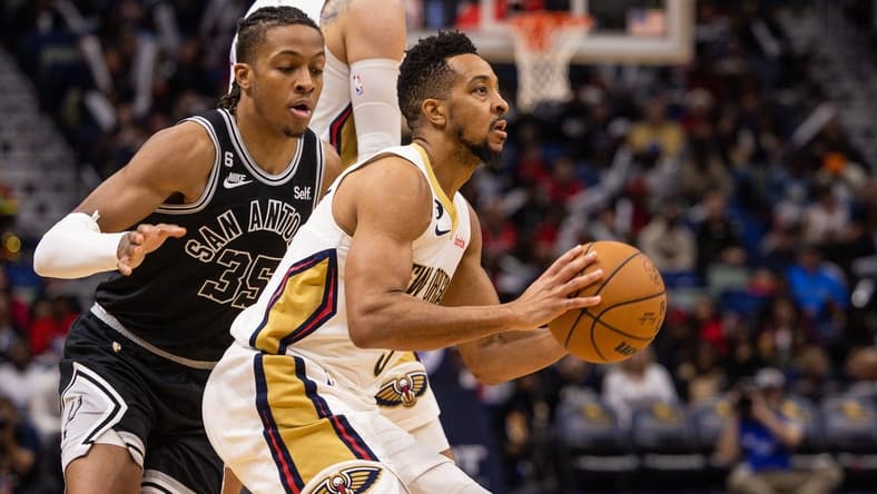 Dec 22, 2022; New Orleans, Louisiana, USA; New Orleans Pelicans guard CJ McCollum (3) shoots a jump shot against San Antonio Spurs guard Romeo Langford (35) during the second half at Smoothie King Center. Mandatory Credit: Stephen Lew-USA TODAY Sports