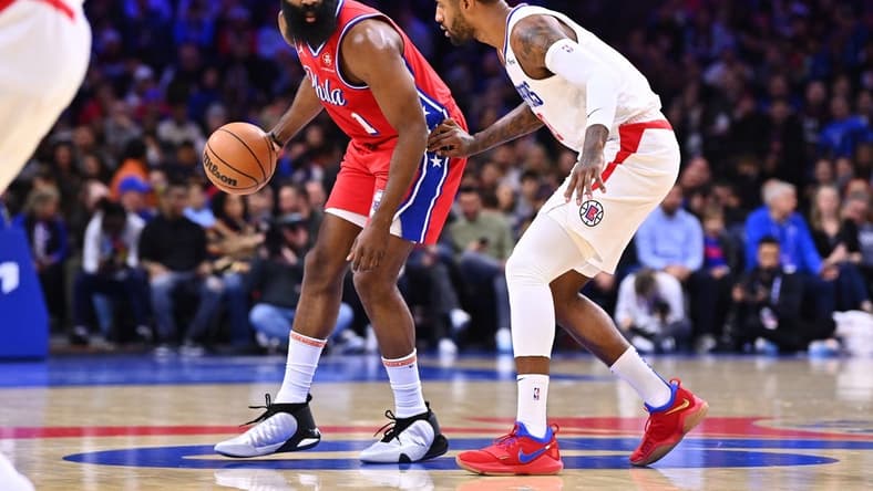 Dec 23, 2022; Philadelphia, Pennsylvania, USA; Philadelphia 76ers guard James Harden (1) shields the ball from Los Angeles Clippers forward Paul George (13) in the first quarter at Wells Fargo Center. Mandatory Credit: Kyle Ross-USA TODAY Sports