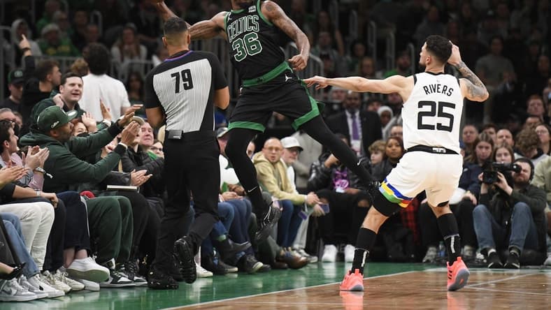 Dec 23, 2022; Boston, Massachusetts, USA; Boston Celtics guard Marcus Smart (36) saves the ball from going out of bounds while Minnesota Timberwolves guard Austin Rivers (25) defends during the first half at TD Garden. Mandatory Credit: Bob DeChiara-USA TODAY Sports