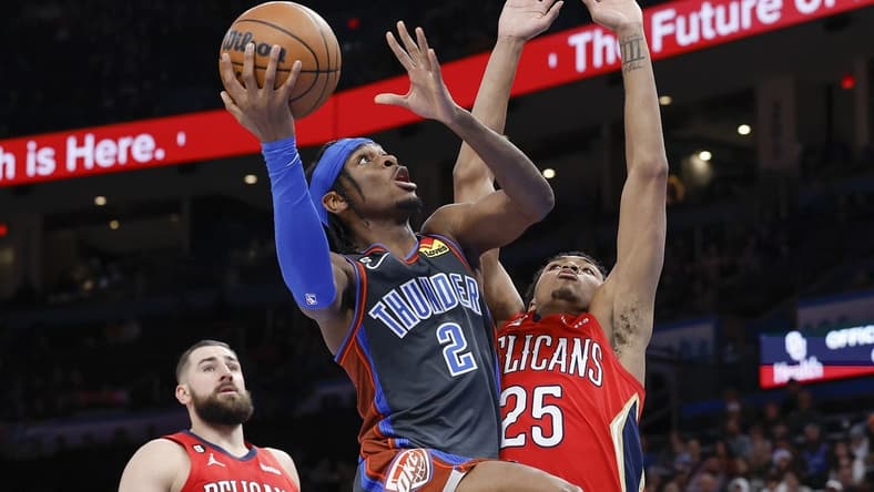 Dec 23, 2022; Oklahoma City, Oklahoma, USA; Oklahoma City Thunder guard Shai Gilgeous-Alexander (2) shoots as New Orleans Pelicans guard Trey Murphy III (25) defends during the second quarter at Paycom Center. Mandatory Credit: Alonzo Adams-USA TODAY Sports