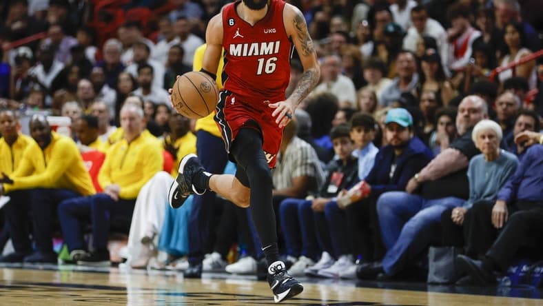 Dec 23, 2022; Miami, Florida, USA; Miami Heat forward Caleb Martin (16) dribbles the basketball during the second quarter against the Indiana Pacers at FTX Arena. Mandatory Credit: Sam Navarro-USA TODAY Sports