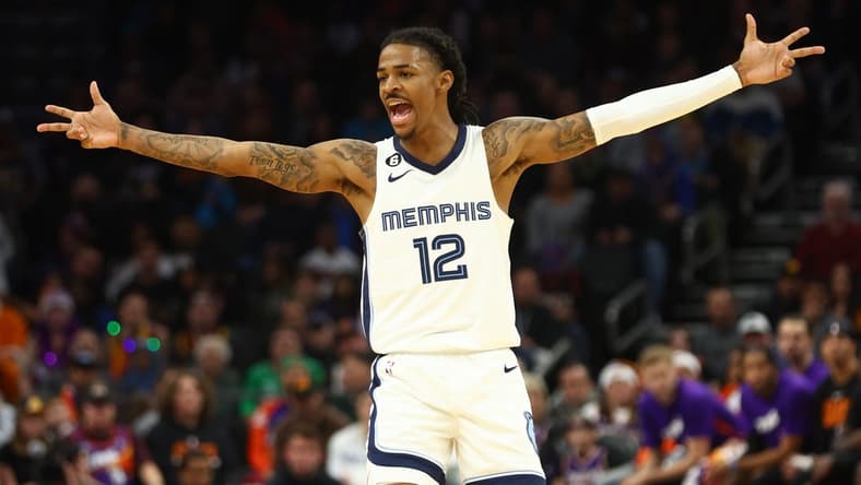 Dec 23, 2022; Phoenix, Arizona, USA; Memphis Grizzlies guard Ja Morant (12) celebrates a shot against the Phoenix Suns in the second half at Footprint Center. Mandatory Credit: Mark J. Rebilas-USA TODAY Sports