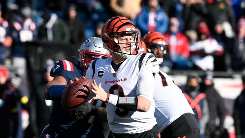 Dec 24, 2022; Foxborough, Massachusetts, USA; Cincinnati Bengals quarterback Joe Burrow (9) throws a pass against the New England Patriots during the first half at Gillette Stadium. Mandatory Credit: Eric Canha-USA TODAY Sports