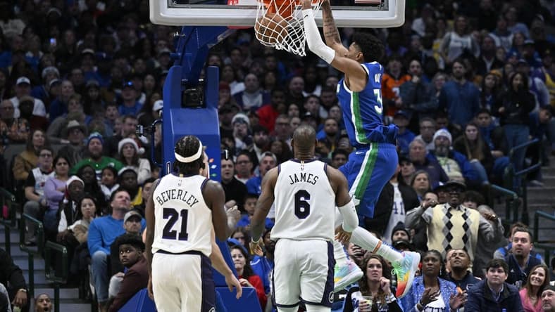 Dec 25, 2022; Dallas, Texas, USA; Dallas Mavericks forward Christian Wood (35) dunks the ball as Los Angeles Lakers guard Patrick Beverley (21) and forward LeBron James (6) look on during the second half at the American Airlines Center. Mandatory Credit: Jerome Miron-USA TODAY Sports