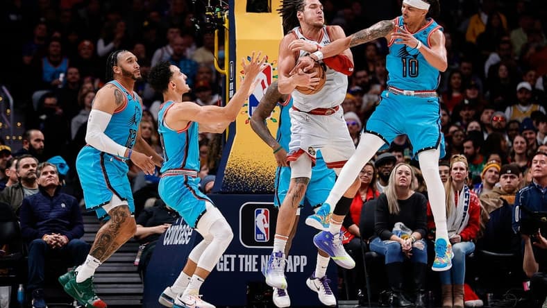 Dec 25, 2022; Denver, Colorado, USA; Denver Nuggets forward Aaron Gordon (50) battles for a rebound with Phoenix Suns guard Damion Lee (10) and guard Landry Shamet (14) as forward Ish Wainright (12) defends in the second quarter at Ball Arena. Mandatory Credit: Isaiah J. Downing-USA TODAY Sports
