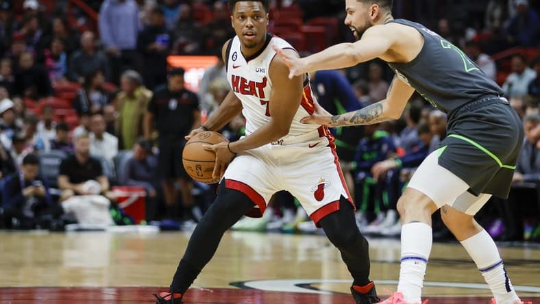 Dec 26, 2022; Miami, Florida, USA; Miami Heat guard Kyle Lowry (7) protects the ball from Minnesota Timberwolves guard Austin Rivers (25) during the first quarter at FTX Arena. Mandatory Credit: Sam Navarro-USA TODAY Sports