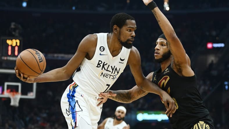 Dec 26, 2022; Cleveland, Ohio, USA; Brooklyn Nets forward Kevin Durant (7) drives to the basket against Cleveland Cavaliers forward Lamar Stevens (8) during the first half at Rocket Mortgage FieldHouse. Mandatory Credit: Ken Blaze-USA TODAY Sports