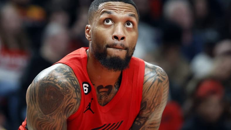 Dec 26, 2022; Portland, Oregon, USA; Portland Trail Blazers point guard Damian Lillard (0) looks on during the first half against the Charlotte Hornets at Moda Center. Mandatory Credit: Soobum Im-USA TODAY Sports