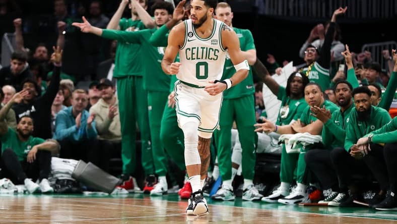 Dec 27, 2022; Boston, Massachusetts, USA; Boston Celtics forward Jayson Tatum (0) reacts after making a three point shot during the first half against the Houston Rockets at TD Garden. Mandatory Credit: Paul Rutherford-USA TODAY Sports