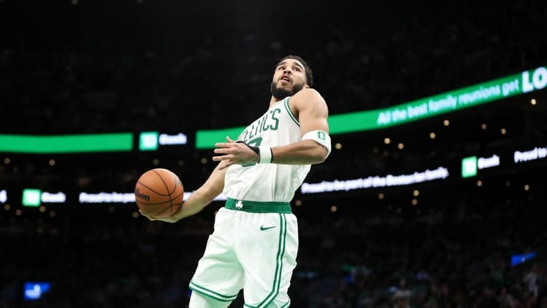 Dec 27, 2022; Boston, Massachusetts, USA; Boston Celtics forward Jayson Tatum (0) dunks the ball during the second half against the Houston Rockets at TD Garden. Mandatory Credit: Paul Rutherford-USA TODAY Sports