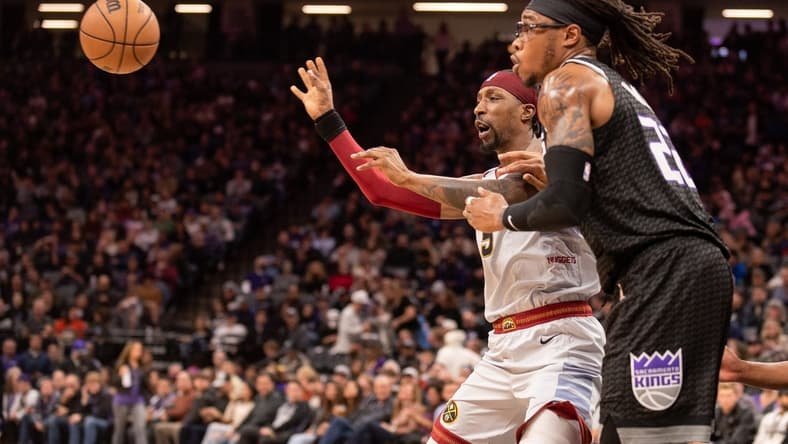 Dec 27, 2022; Sacramento, California, USA; Denver Nuggets guard Kentavious Caldwell-Pope (5) receives a pass during the second quarter against Sacramento Kings center Richaun Holmes (22) at Golden 1 Center. Mandatory Credit: Ed Szczepanski-USA TODAY Sports