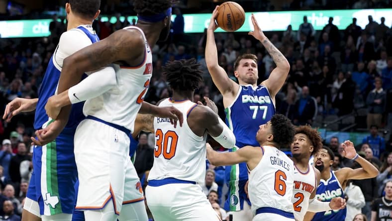 Dec 27, 2022; Dallas, Texas, USA;  Dallas Mavericks guard Luka Doncic (77) scores near the end of the fourth quarter against the New York Knicks at American Airlines Center. Mandatory Credit: Kevin Jairaj-USA TODAY Sports