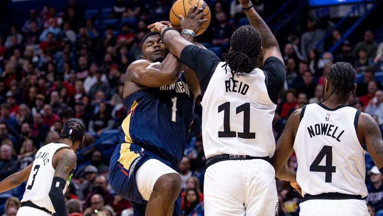 Dec 28, 2022; New Orleans, Louisiana, USA; Minnesota Timberwolves center Naz Reid (11) fouls New Orleans Pelicans forward Zion Williamson (1) as he goes to the basket during the first half at Smoothie King Center. Mandatory Credit: Stephen Lew-USA TODAY Sports